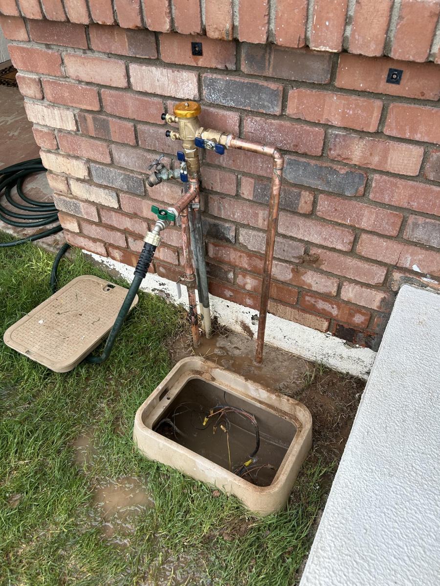 After: new backflow preventer and copper riser