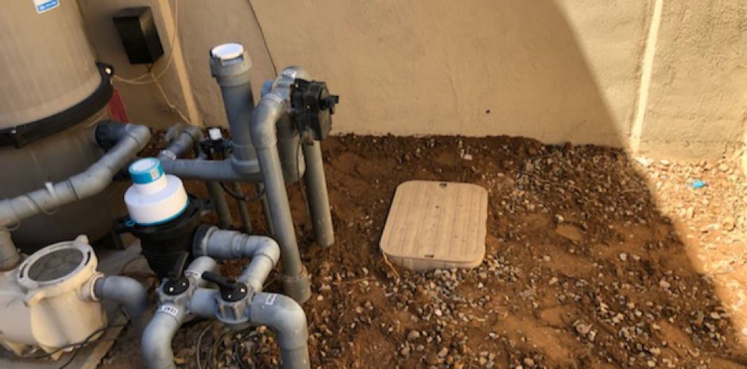 Finished: valve box set to grade next to the pool equipment
